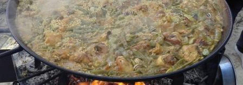 I 10 migliori ristoranti di paella a Valencia 2 paella valenciana sul fuoco